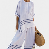 Sukienka z szerokimi paskami i asymetrycznym krojem - nowoczesny i wygodny styl