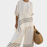 Sukienka z szerokimi paskami i asymetrycznym krojem - nowoczesny i wygodny styl