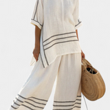 Sukienka z szerokimi paskami i asymetrycznym krojem - nowoczesny i wygodny styl