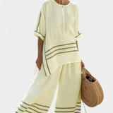 Sukienka z szerokimi paskami i asymetrycznym krojem - nowoczesny i wygodny styl